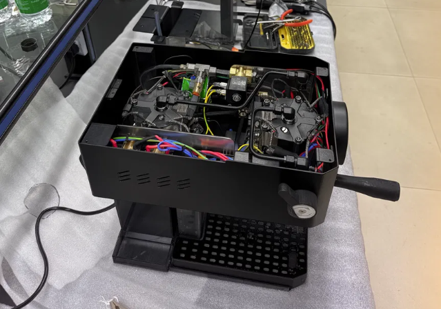Prototype espresso machine on a workbench